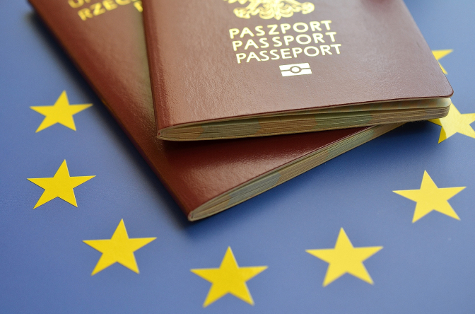 passports on EU stars background